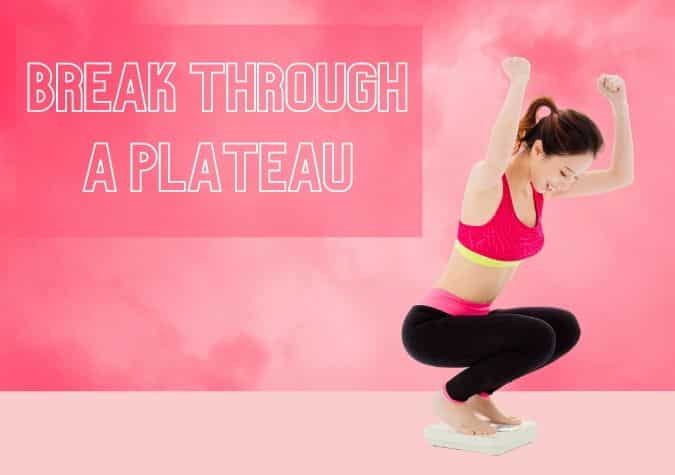 Break Through a Plateau: Woman on scale.
for post how to break the weight loss plateau